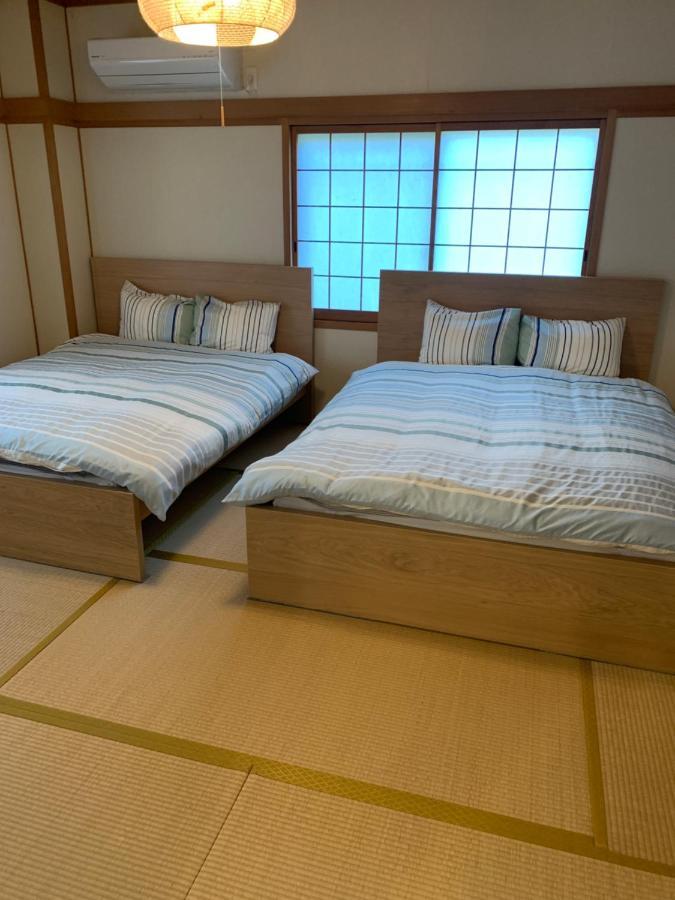 Guest House Apple โอซาก้า ภายนอก รูปภาพ